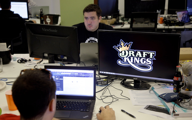 ASSOCIATED PRESS
                                In this Sept. 9, 2015, file photo, Len Don Diego, marketing manager for content at DraftKings, a daily fantasy sports company, works at his station at the company’s offices in Boston.