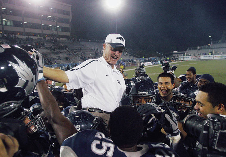 ASSOCIATED PRESS
                                Nevada Wolf Pack head coach Chris Ault sits on the shoulders of his players after the NCAA college football game in celebration of his 200th win at Mackay Stadium in Reno, Nev., on Oct. 9, 2009.