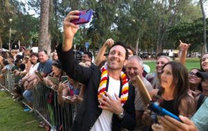 CINDY ELLEN RUSSELL / CRUSSELL@STARADVERTISER.COM
                                “Hawaii Five-0” actor Alex O’Loughlin snaps a selfie with fans this evening at the Sunset on the Beach premiere in Waikiki.