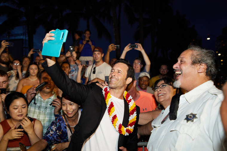 COURTESY CBS
                                “Hawaii Five-0” series star Alex O’Loughlin spends some time with fans at the Sunset on the Beach premiere in Waikiki on Sept. 19.