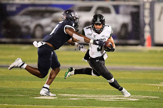 STEVEN ERLER / Special to the Honolulu Star-Advertiser
                                Hawaii Rainbow Warriors wide receiver Jason-Matthew Sharsh eluded a tackle of Nevada Wolf Pack defensive back Tyson Williams during the first half of a game against the Nevada Wolf Pack on Saturday at Mackay Stadium in Reno.
