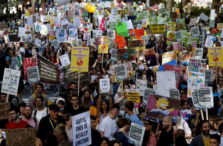 ASSOCIATED PRESS
                                Climate protesters demonstrate idn London, today. Protesters around the world joined rallies today as a day of worldwide demonstrations calling for action against climate change began ahead of a U.N. summit in New York.