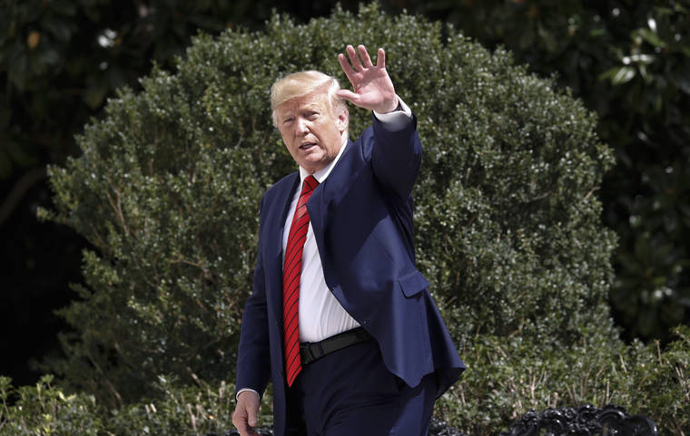 ASSOCIATED PRESS
                                President Donald Trump gestures towards members on the media on the South Lawn of the White House in Washington today after returning from United Nations General Assembly.