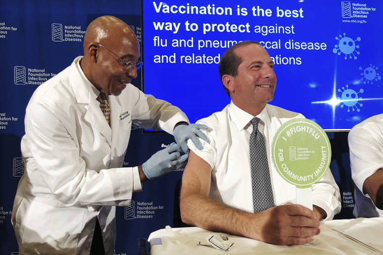 ASSOCIATED PRESS
                                B.K. Morris, a nurse with MedStar Visiting Nurses Association, gave a flu shot to Secretary of Health and Human Services Alex Azar during a news conference in Washington. The flu forecast is cloudy and it’s too soon to know if the U.S. is in for a third miserable season in a row, but health officials said, Thursday, not to delay vaccination.b