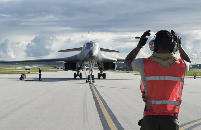 U.S. AIR FORCE BY TECH. SGT. RICHARD P. EBENSBERGER VIA THE AP / 2017
                                A U.S. Air Force B-1B Lancer arrives at Andersen Air Force Base, Guam. President Donald Trump is raising a large chunk of the money for his border wall with Mexico by deferring several large military construction projects slated for the strategically important Pacific outpost of Guam. This may disrupt plans to move Marines to Guam from Japan and to modernize important munitions storage for the Air Force. About 7% of the funds for the $3.6 billion wall are being diverted from eight projects in U.S. territory.