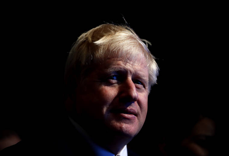ASSOCIATED PRESS
                                Prime Minister Boris Johnson listened to Sajid Javid, Chancellor of the Exchequer, as he delivered his speech at the Conservative Party Conference in Manchester, England, today.