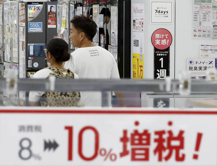 ASSOCIATED PRESS
                                A signboard says “Consumption tax hike, 8 percent to 10 percent”, at a mass home electronics retailer in Tokyo. Japan has raised consumption tax to 10 percent from 8 percent, amid concerns that it could sink the Japanese economy though government officials say ample measures are taken to minimize the impact.