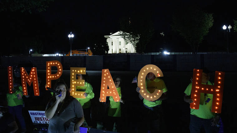 ASSOCIATED PRESS
                                Protesters with “Kremlin Annex” call to impeach President Donald Trump in Lafayette Square Park in front of the White House in Washington Tuesday. House Speaker Nancy Pelosi announced a formal impeachment inquiry into President Donald Trump earlier in the day.