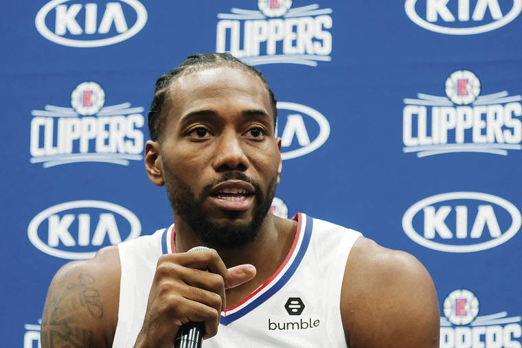 ASSOCIATED PRESS
                                <strong>Kawhi Leonard:</strong>
                                <em>Might join Paul George on the bench in Hawaii</em>