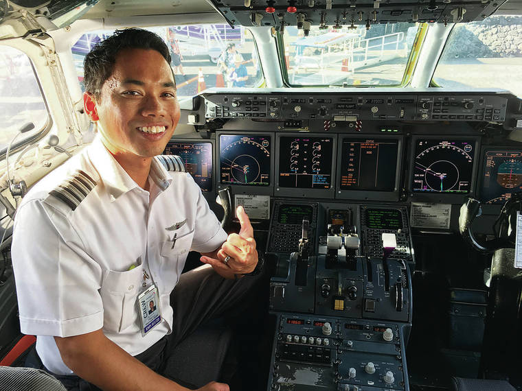 COURTESY NOLAN MADRIAGA
                                Capt. Nolan Madriaga sits in the cockpit of a Hawaiian Airlines jet.