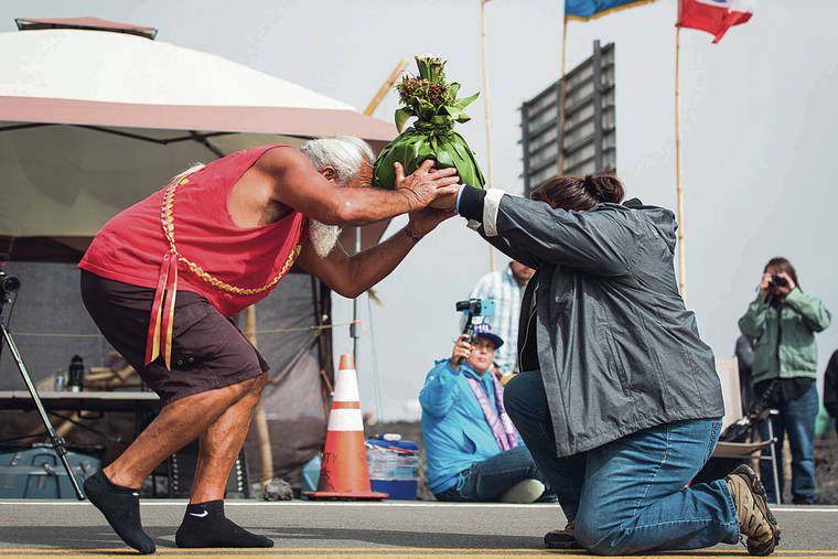 RONIT FAHL / SPECIAL TO THE STAR-ADVERTISER
                                Kupuna Billy Freitas received an offering from the OHA board of trustees during afternoon protocol at Mauna Kea last week.