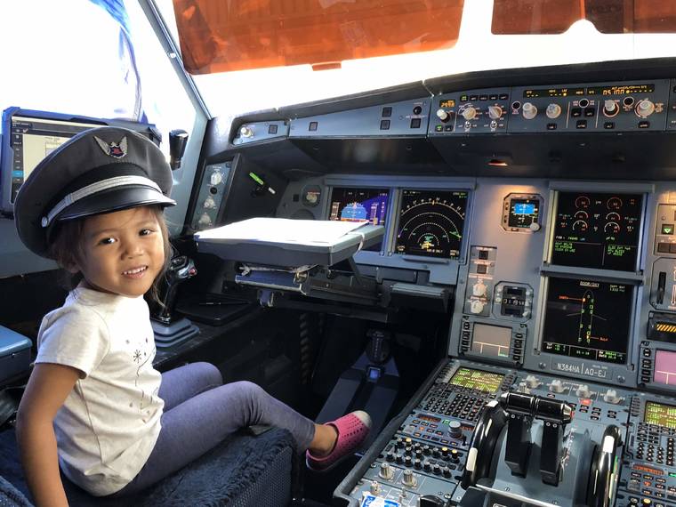 COURTESY NOLAN MADRIAGA
                                Capt. Nolan Madriaga’s daughter sits in the pilot’s chair of her dad’s plane.