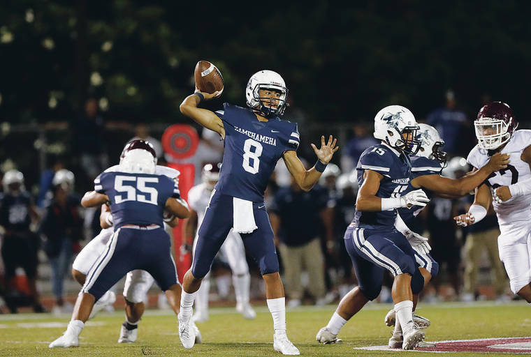 CINDY ELLEN RUSSELL / CRUSSELL@STARADVERTISER.COM
                                Kamehameha quarterback Kiai Keone (8) goes to pass the ball during the first half of Saturday’s game against the Farrington Governors.