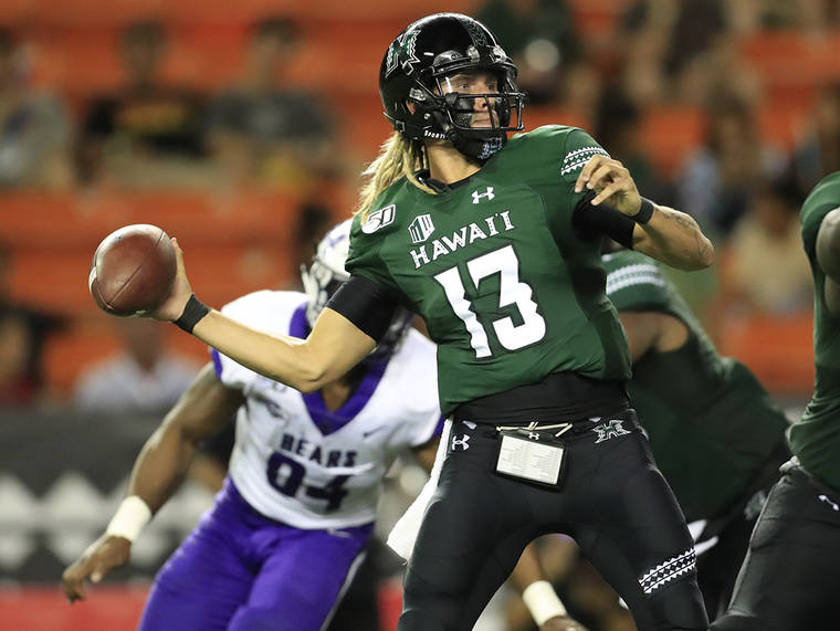 JAMM AQUINO/JAQUINO@STARADVERTISER.COM
                                Hawaii quarterback Cole McDonald (13) throws the football against the Central Arkansas Bears during the first half of a college football game on Sept. 21, 2019 at Aloha Stadium.