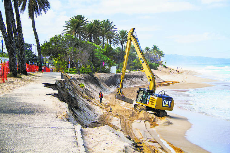 DENNIS ODA / 2017
                                Erosion is seen at Sunset Beach where part of the bike path collapsed and a shed owned by lifeguards hangs over a newly formed cliff.