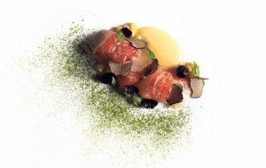 CINDY ELLEN RUSSELL / CRUSSELL@STARADVERTISER.COM
                                Chilled Keahole lobster is served with summer truffle, corn pudding, pickled blueberry, Thai basil and matcha.
