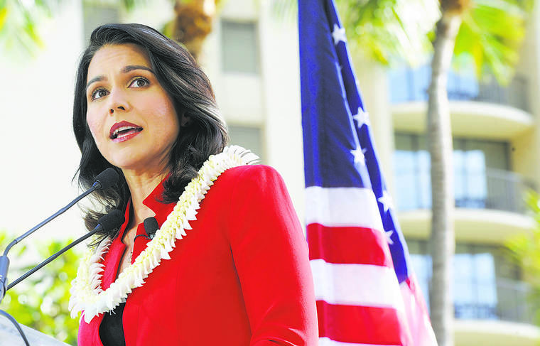 BRUCE ASATO / BASATO@STARADVERTISER.COM
                                Hawaii Congresswoman Tulsi Gabbard talks to supporters in front of Hilton Hawaiian Village Resort in Waikiki, Feb. 2.