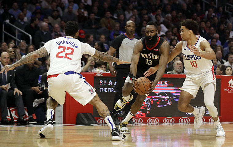 ASSOCIATED PRESS
                                Houston Rockets’ James Harden dribbled between Los Angeles Clippers’ Wilson Chandler, left, and Jerome Robinson during the second half of a game, April 3, in Los Angeles. Harden is expected to play “probably 25” of a possible 48 minutes in Thursday night’s preseason exhibition against the Los Angeles Clippers at the Stan Sheriff Center, Rockets coach Mike D’Antoni said today.
