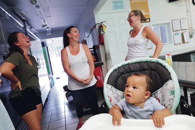 JAMM AQUINO / JAQUINO@STARADVERTISER.COM
                                From left, Amber Taylor, mother of eight-month-old Leo Kelechi, foreground, and Healthy Baby Hawaii owners Aly Akina, middle, and Nicole Dodson, share a laugh at Healthy Baby Hawaii’s kitchen on Monday, Sept. 16, 2019 in Kailua. Healthy Baby Hawaii is a local company which makes fresh, organic food for babies.