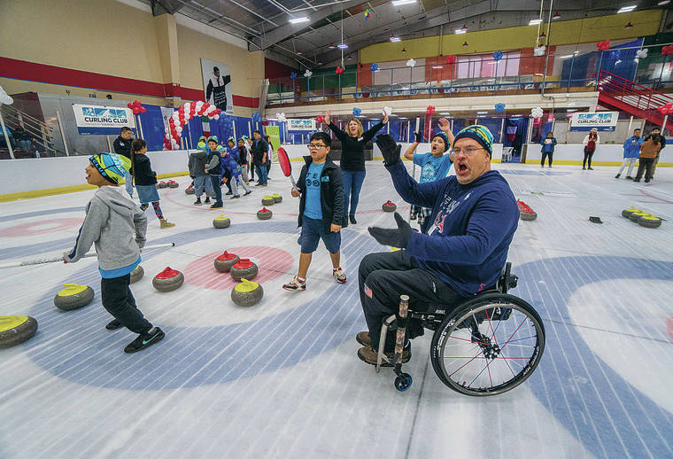 DENNIS ODA / DODA@STARADVERTISER.COM
                                This is Paralympian Steve Emt (right) giving the students a cheer as the “rock” slid into the right location. Olympic gold medalist Tyler George and Steve Emt show students from Kanoelani Elementary School how to curl during a clinic at the Ice Palace. The two Olympians are in town to assist American Savings Bank in hosting it’s seventh annual Hawaii Curling Club Charity Classic that will take place later in the day as a fundraiser for We Are Oceania, an organization aimed at centralizing the support system for all Micronesian communities, families and individuals in Hawaii. 20 teams representing businesses across the state will participate in two separate competitions to raise money for We Are Oceania.