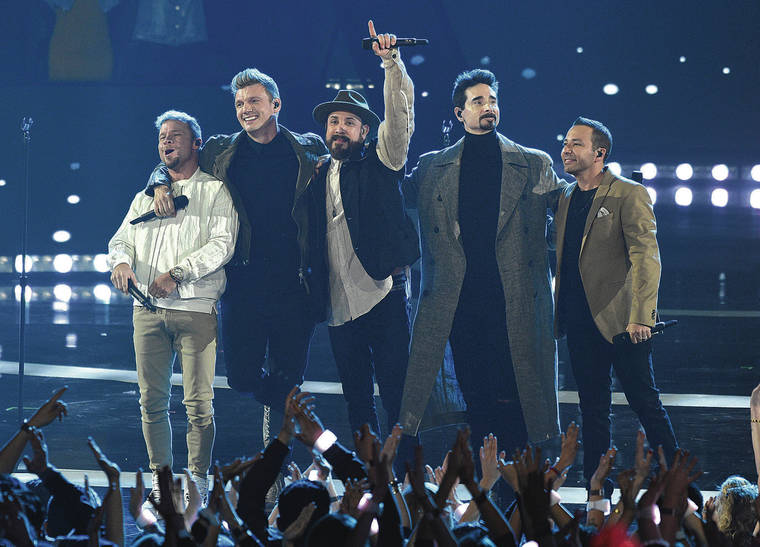 ASSOCIATED PRESS
                                Brian Littrell, from left, Nick Carter, AJ McLean, Kevin Richardson and Howie Dorough, of Backstreet Boys, greet the audience after performing at the iHeartRadio Music Awards on March 14. The Backstreet Boys will perform in Honolulu for four shows.