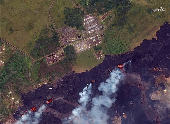 ASSOCIATED PRESS VIA DIGITALGLOBE
                                This satellite photo provided by DigitalGlobe shows lava from Kilauea fissures approaching the Puna Geothermal Venture energy plant in Pahoa on May 23, 2018.
