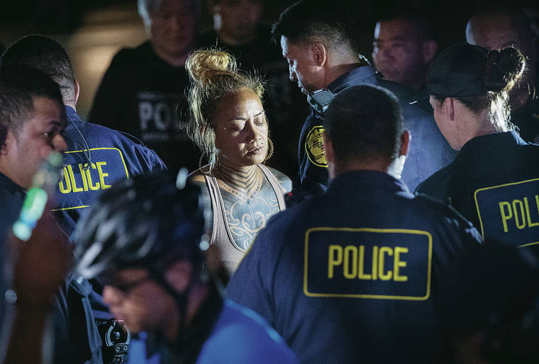 CINDY ELLEN RUSSELL / CRUSSELL@STARADVERTISER.COM
                                Over 25 people were arrested, including Lilia Fonoimoana.