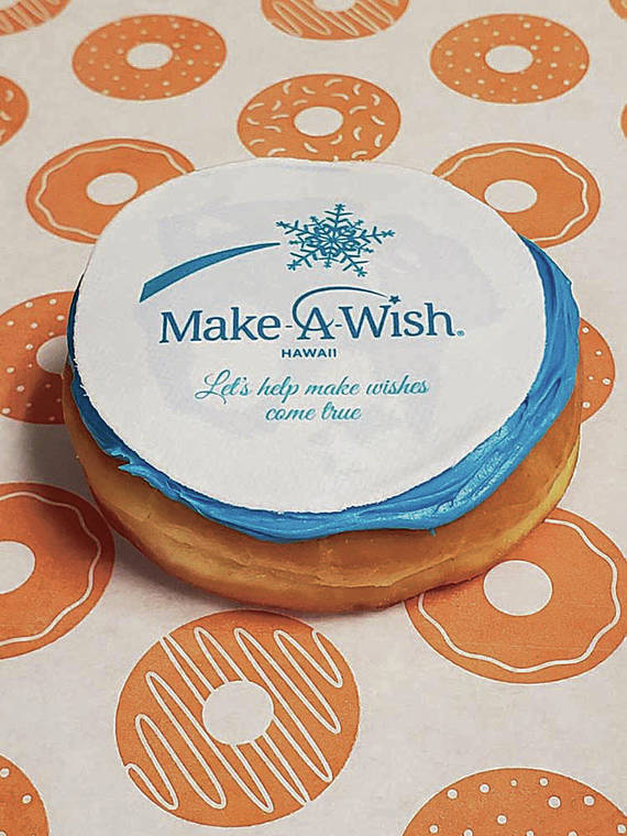COURTESY DUNKIN’
                                Doughnuts to benefit Make-A-Wish are made with edible sugar paper topping.