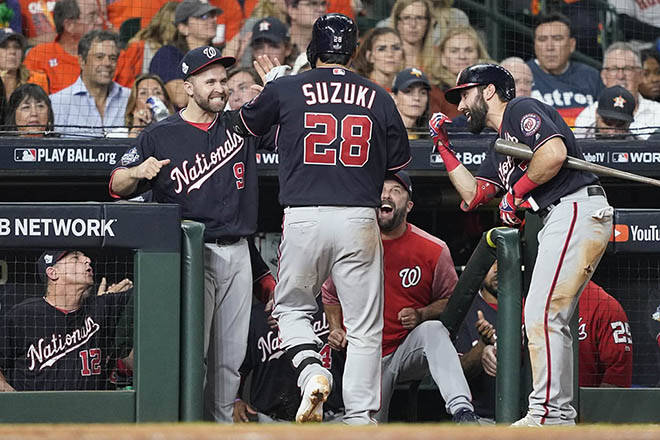 ASSOCIATED PRESS
                                Washington Nationals’ Kurt Suzuki is congratulated after hitting a home run during the seventh inning of Game 2 of the baseball World Series against the Houston Astros Wednesday in Houston. The Nationals won 12-3 to take a 2-0 lead in the series.