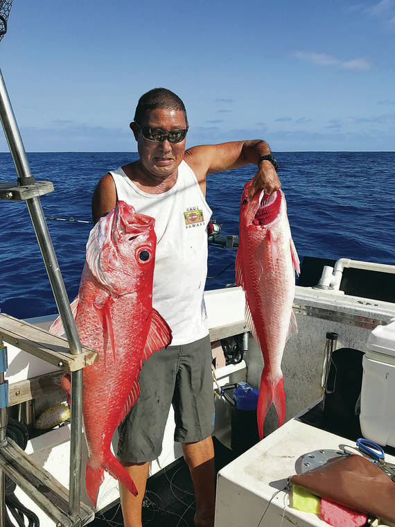 COURTESY ROY MORIOKA
                                Fisher Mack Matsuura holds up a pair of 20-pound onaga.