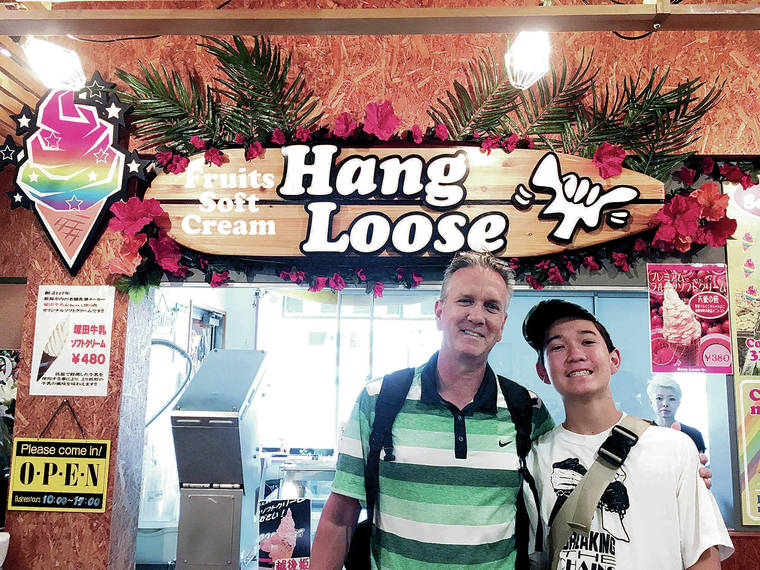 Sean and Tristan Simmons found Hang Loose at Pier Bandai in Niigata, Japan, in May. The store serves fresh fruit blended into a soft serve ice cream cone; they chose lychee and mango. Photo by Shari Simmons.