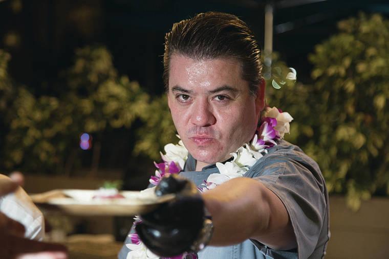 KAT WADE / SPECIAL TO THE STAR ADVERTISER
                                Chef Katsuji Tanabe strikes a samurai pose as he serves his beef dish.
