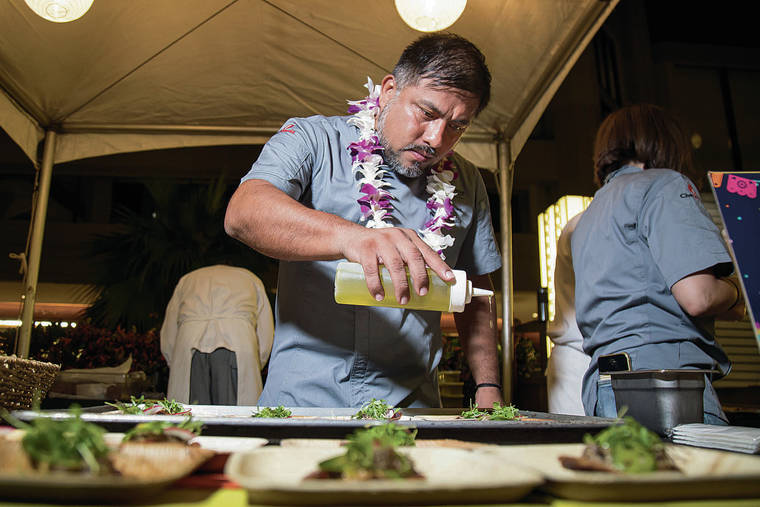 KAT WADE / SPECIAL TO THE STAR ADVERTISER
                                Chef Ricardo Zarate drizzles a ceviche sauce over his plates of seared ahi.