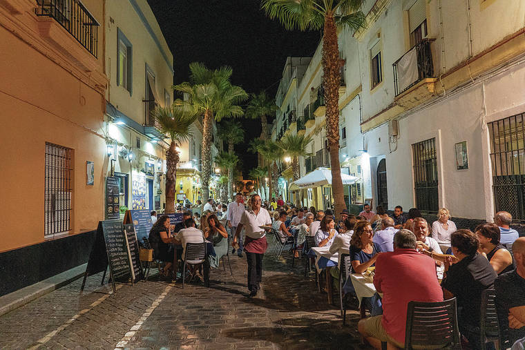NEW YORK TIMES
                                The neighborhood of La Viña is packed with open-air restaurants in Cádiz, Spain.