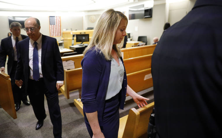 TOM FOX/THE DALLAS MORNING NEWS VIA ASSOCIATED PRESS
                                Fired Dallas police officer Amber Guyger left the courtroom after a jury found her guilty of murder, today, in Dallas. Guyger shot and killed Botham Jean, an unarmed 26-year-old neighbor in his own apartment last year.