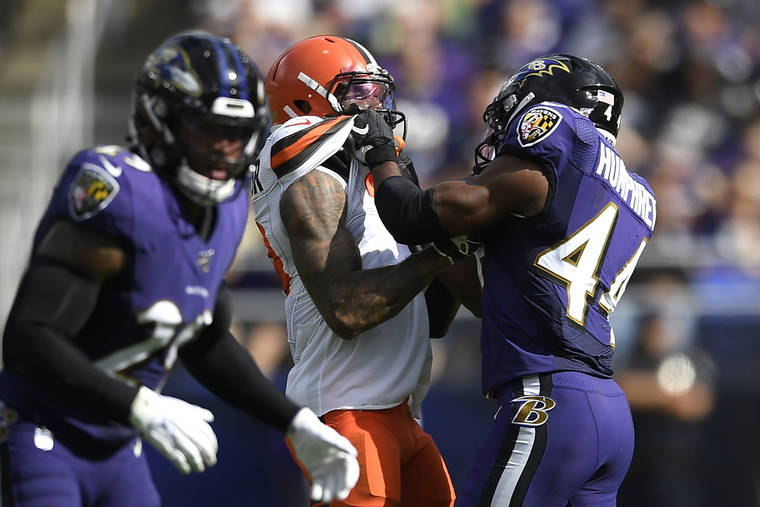 ASSOCIATED PRESS
                                Cleveland Browns wide receiver Odell Beckham, center, and Baltimore Ravens cornerback Marlon Humphrey (44) grab each other during the second half of an NFL football game in Baltimore on Sept. 29. Browns coach Freddie Kitchens wants more consistent NFL officiating after wide receiver Odell Beckham Jr. was choked. Beckham got into a skirmish with Ravens cornerback Marlon Humphrey, who pinned the three-time Pro Bowler and had his hands around his neck before being pulled away. Both players were assessed personal fouls, but neither was ejected. Kitchens said he planned to reach out to the league about that situation in particular and officiating evenness in general.