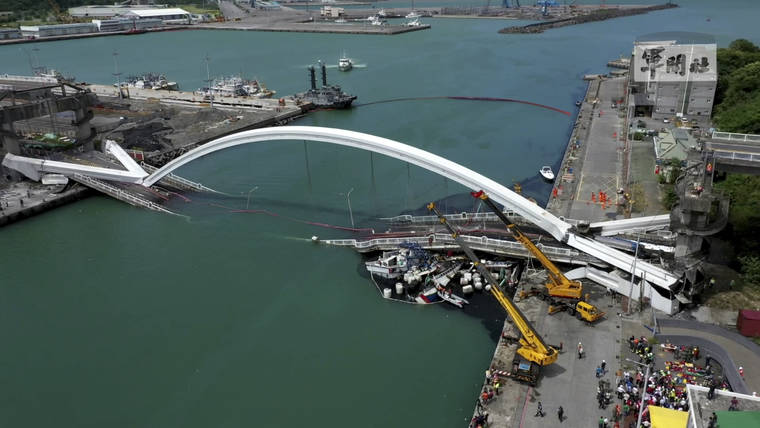 TAIWAN’S MILITARY NEWS AGENCY VIA AP
                                This image made from video provided by Taiwan’s Military News Agency shows Nanfangao Bridge, collapsed in Nanfangao, eastern Taiwan. The towering arch bridge over a bay collapsed Tuesday, sending a burning oil tanker truck falling onto boats in the water below.