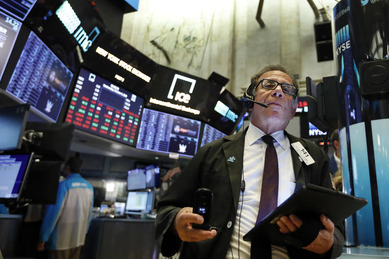 ASSOCIATED PRESS
                                Trader Sal Suarino worked on the floor of the New York Stock Exchange, today. Stocks tumbled again today as worries about a weakening global economy boomeranged around the world.