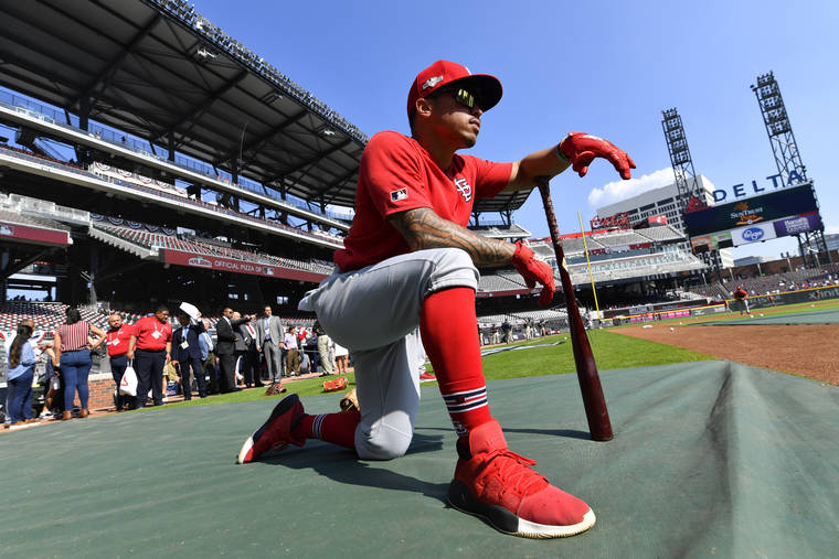 ASSOCIATED PRESS St. Louis Cardinals second baseman Kolten Wong (16) waits to bat during practice ahead of Game 1 of a best-of-five National League Division Series between the Atlanta Braves and the St. Louis Cardinals, today in Atlanta.