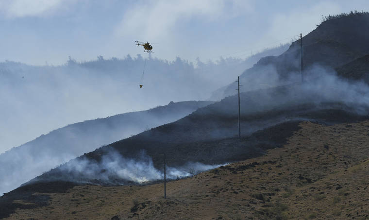 ASSOCIATED PRESS
                                In this Oct. 2, 2109 photo, a wildfire above Maalaea blackened the slopes of the West Maui Mountains.