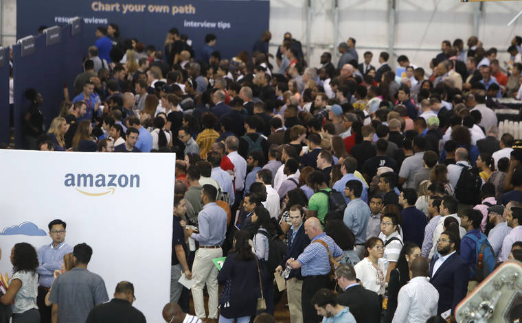 ASSOCIATED PRESS
                                Job seekers lined up to speak to recruiters during an Amazon job fair, Sept. 17, in Dallas. The U.S. government, today, issued the September jobs report.