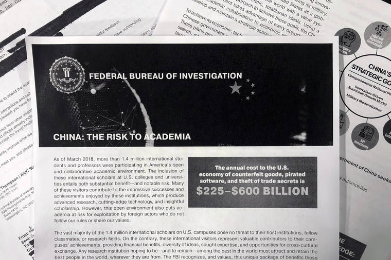 ASSOCIATED PRESS
                                The FBI’s outreach to American colleges and universities about the threat of economic espionage includes this pamphlet that warns specifically about efforts by China to steal academic research.