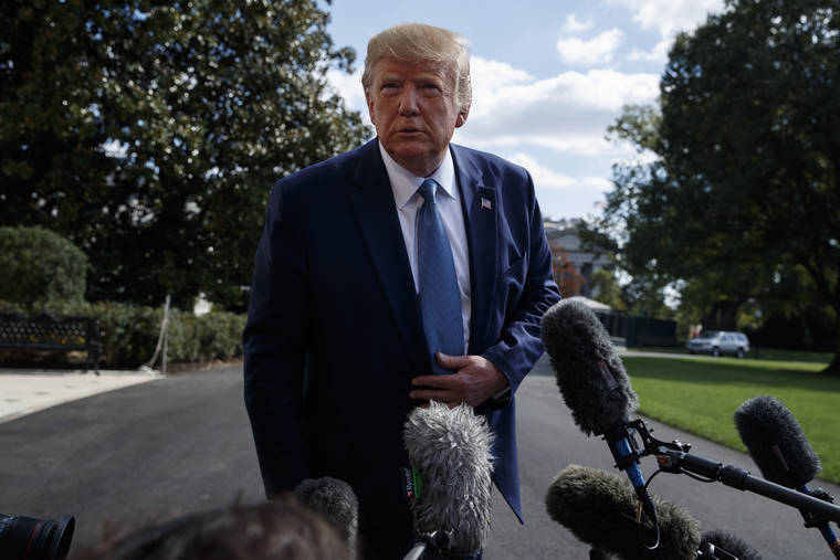 ASSOCIATED PRESS
                                President Donald Trump talked to reporters on the South Lawn of the White House, Friday, in Washington.