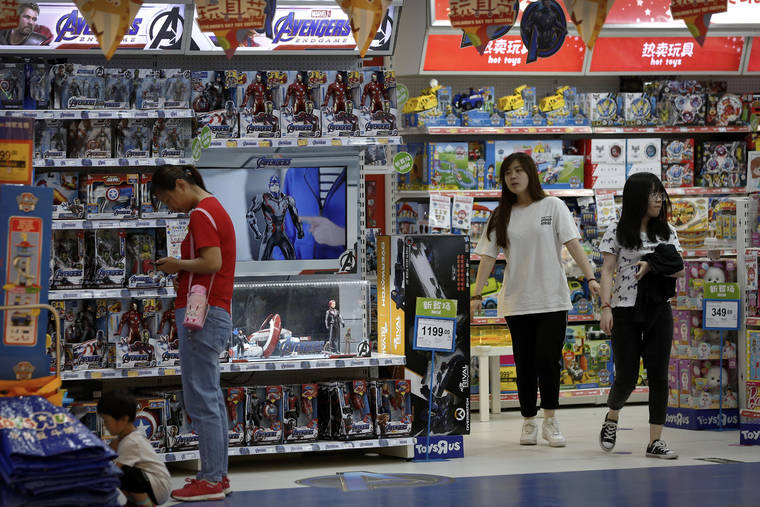 ASSOCIATED PRESS
                                Customers shopped near a section selling Marvel Avengers toys by American toymaker Hasbro, May 23, at a toy store in Beijing. The nation’s business economists think President Donald Trump’s trade war with China will contribute to a sharp slowdown in economic growth this year and next, raising concerns about a possible recession starting late next year.