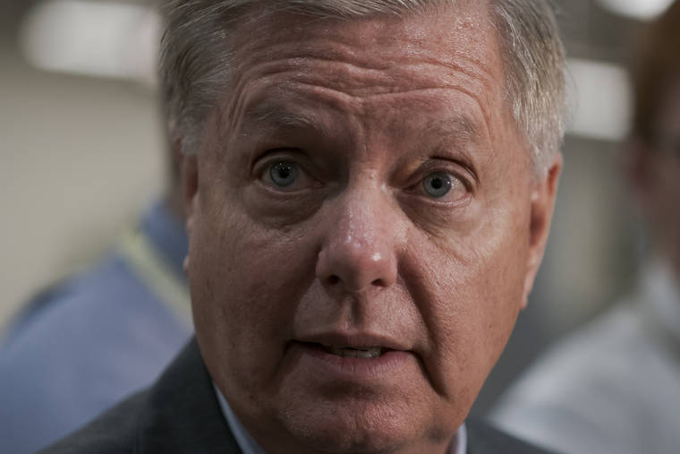 ASSOCIATED PRESS
                                Senate Judiciary Committee Chairman Lindsey Graham, R-S.C., took questions from reporters following a closed-door briefing on Iran, at the Capitol in Washington, Sept. 25.