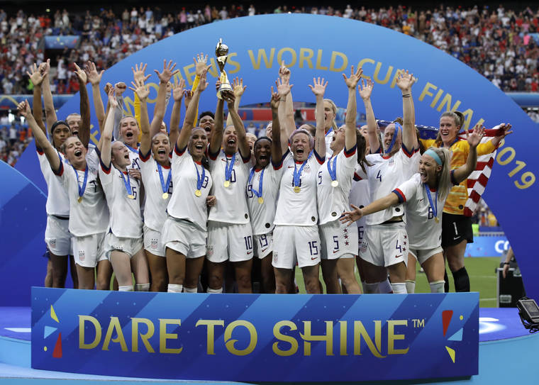 ASSOCIATED PRESS
                                United States soccer team members celebrate with the trophy after winning the Women’s World Cup final soccer match between U.S. and the Netherlands at the Stade de Lyon in Decines, outside Lyon, France in July.