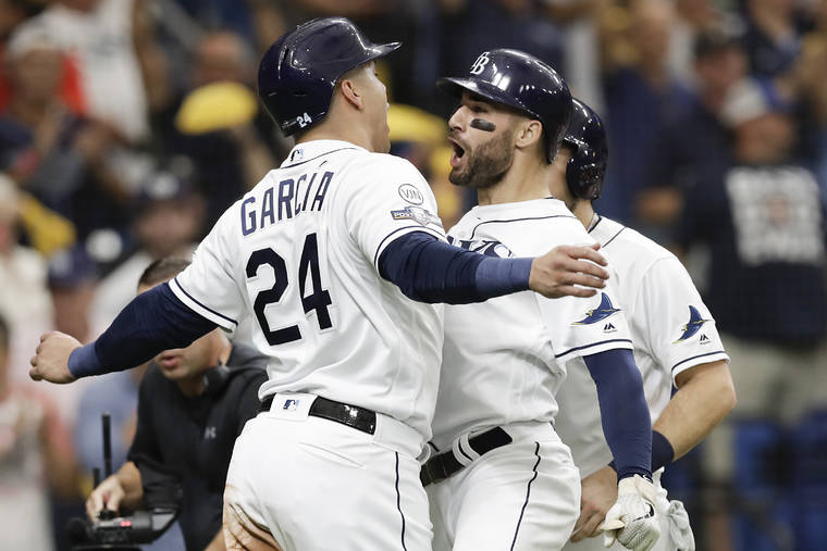 ASSOCIATED PRESS
                                Tampa Bay Rays’ Kevin Kiermaier, right, celebrates his 3-run home run in the second inning against the Houston Astros with Avisail Garcia (24) during Game 3 of a baseball American League Division Series, today in St. Petersburg, Fla.