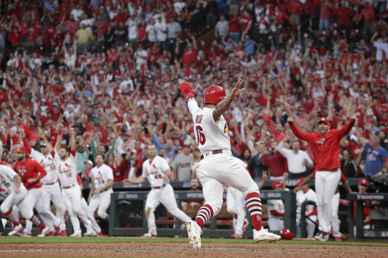Yadier Molina wins it in 10th as Cardinals top Braves to force Game 5 | Honolulu Star-Advertiser