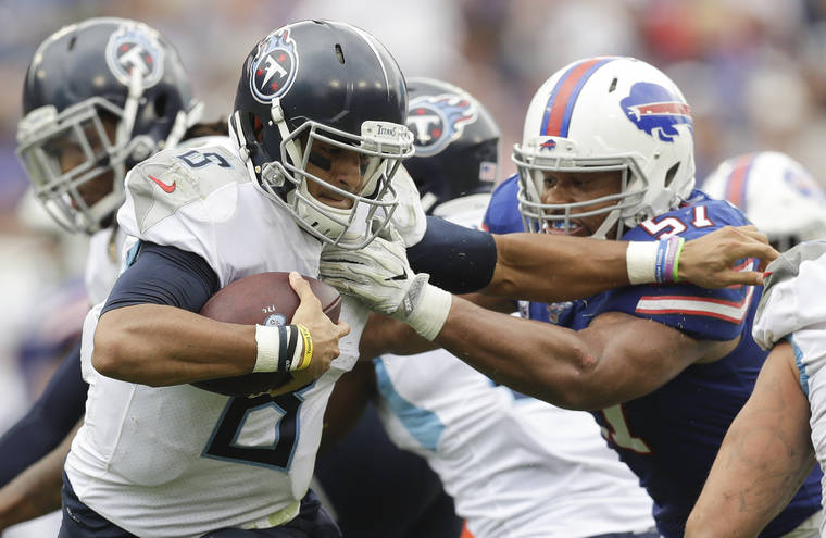 ASSOCIATED PRESS
                                Tennessee Titans quarterback Marcus Mariota tries to get past Buffalo Bills outside linebacker Lorenzo Alexander in the second half.