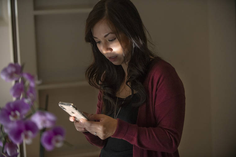ASSOCIATED PRESS
                                Emergency room physician, Dr. Anna Nguyen used her smartphone, Aug. 28, to communicate with a remote patient from her Sacramento, Calif., home. The medical industry is seeing a growing form of care where doctors diagnose, treat and prescribe through secure text messages.